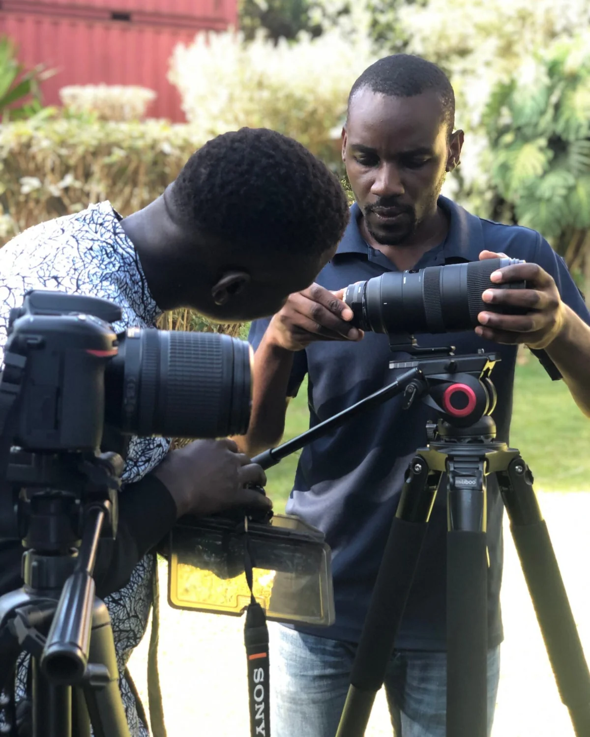 A BeniTeam videographer preparing a production