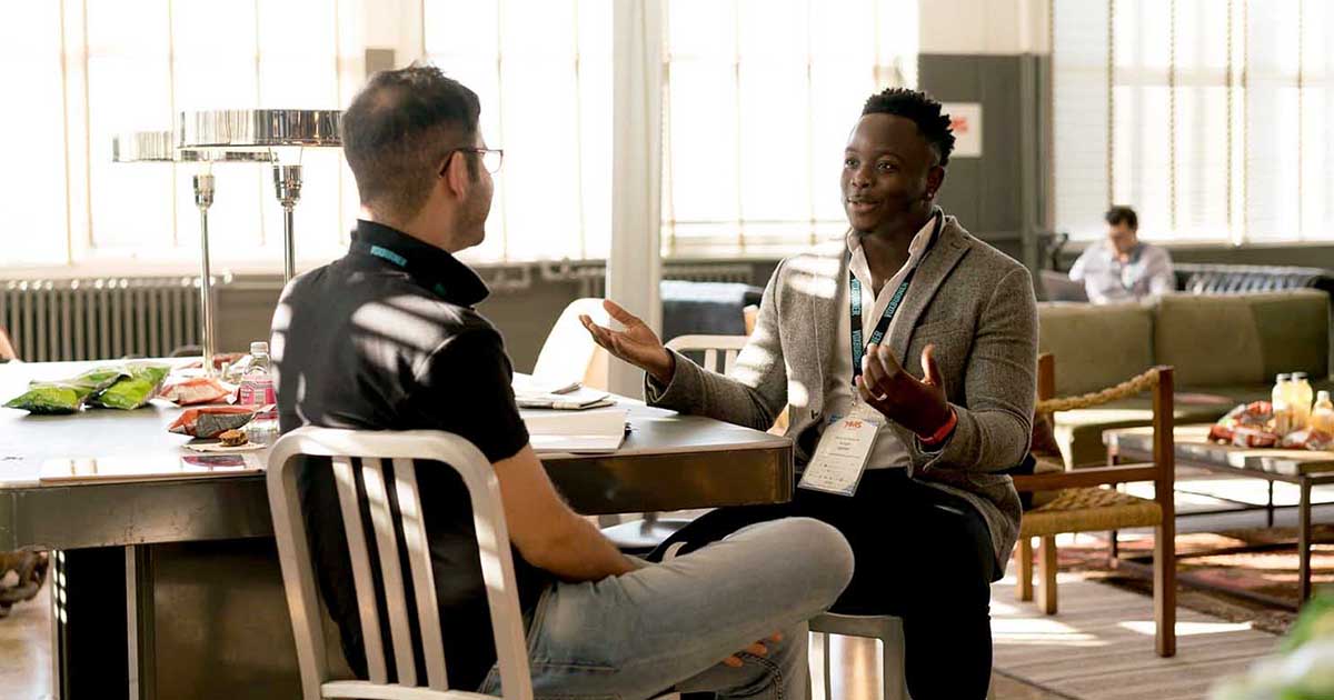 Two men discussing in office